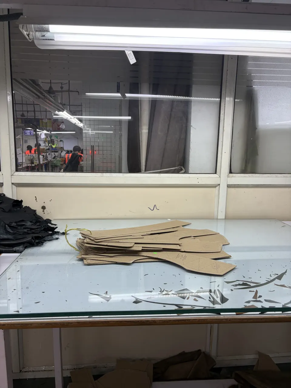 Hide Fashion cut leather components on the worktable.