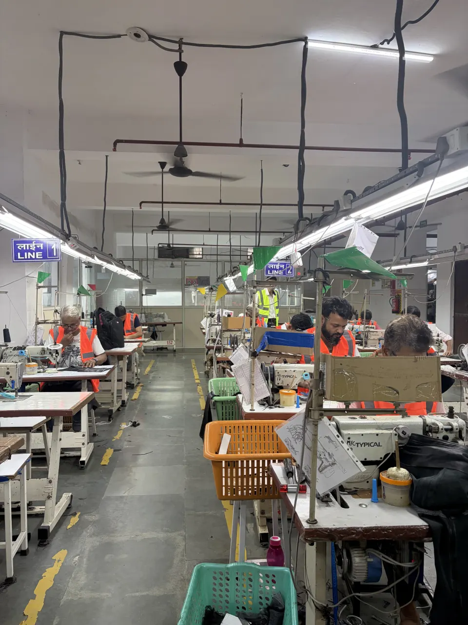 Hide Fashion a view along the sewing floor and its workstations.