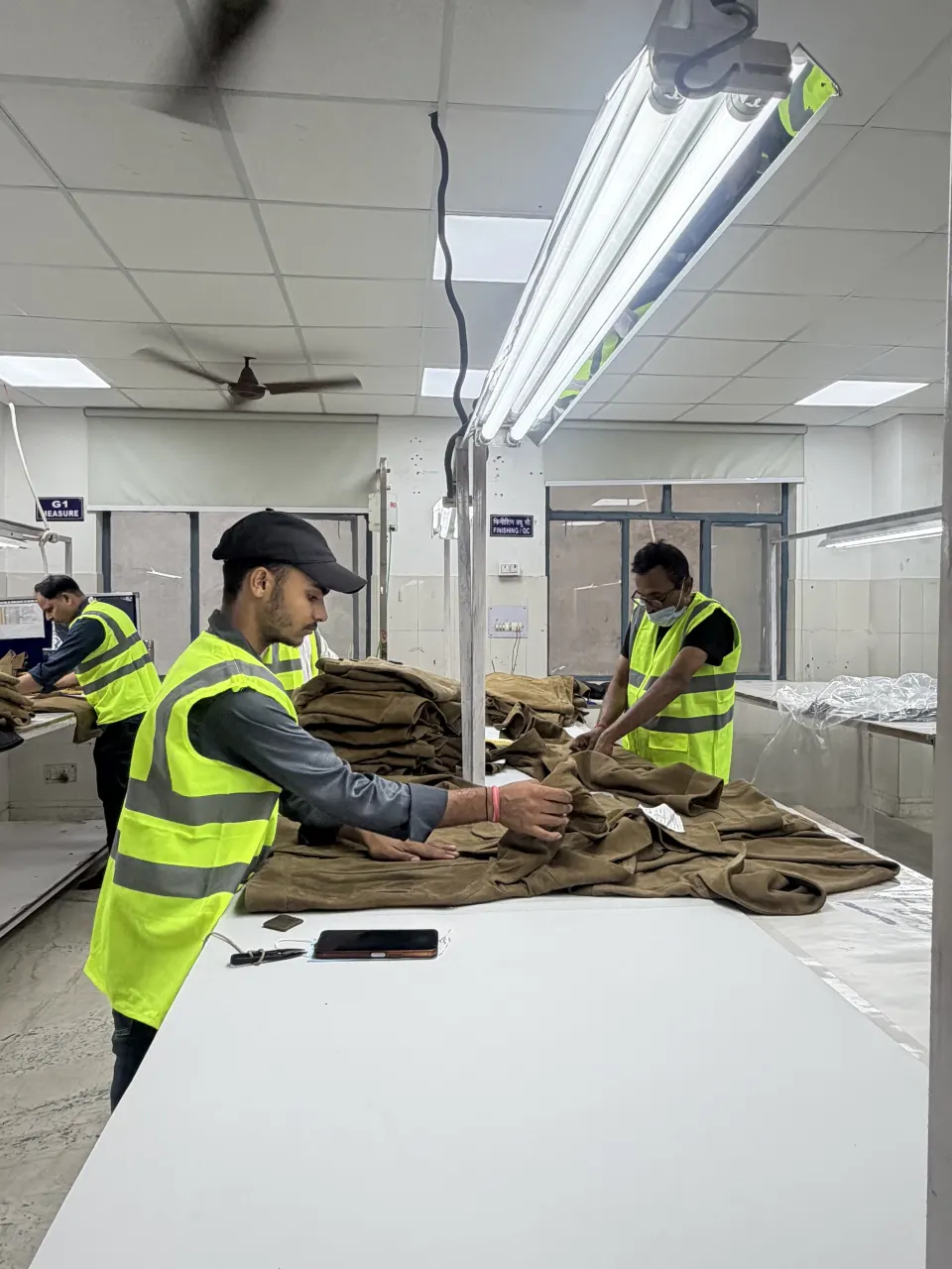 Hide Fashion a wider view of garment handling in the finishing and inspection area.